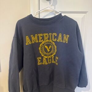 American Eagle Outfitters distressed Navy and Yellow Crewneck Sweater